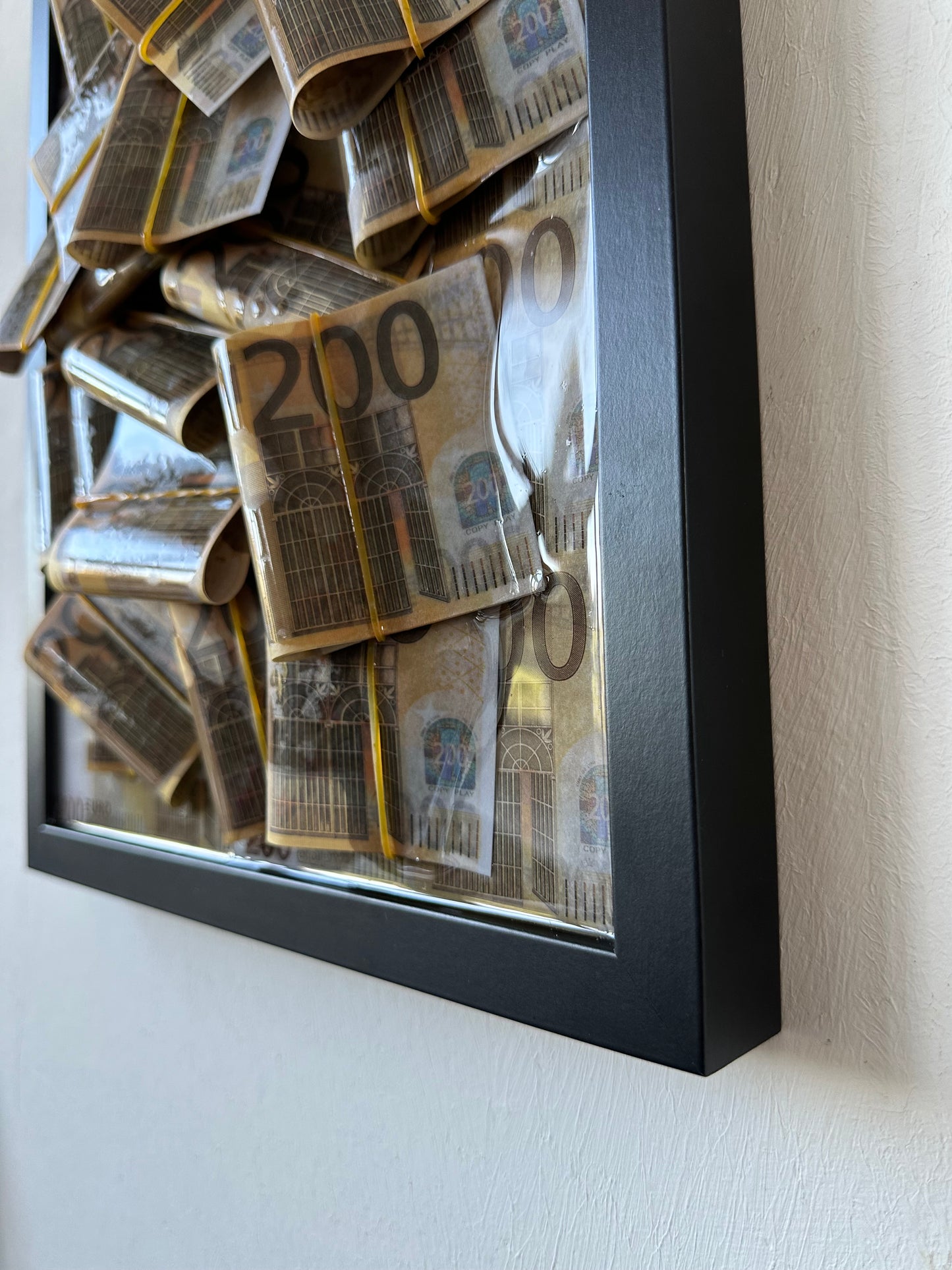 Quadro Raised Riches 200€ - Black